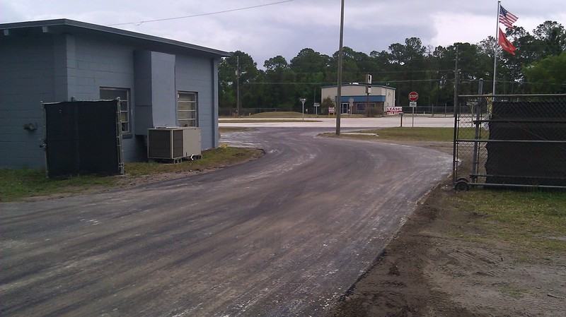 Parking lot repavement after photo: the repaved parking lot finished and ready for use, view 2 of 2