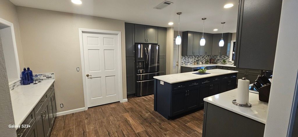 Kitchen remodel after photo: the remodeled kitchen finished and ready for use, view 2 of 2