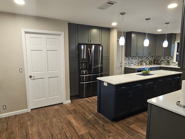 Kitchen remodel after photo: the remodeled kitchen finished and ready for use, view 2 of 2