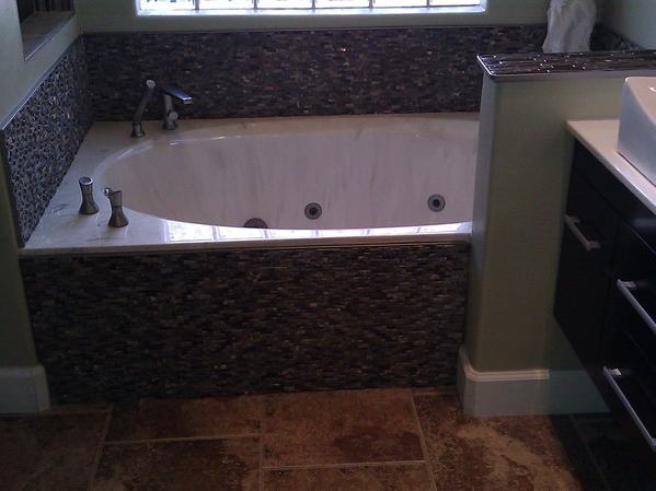 Bathroom tub replacement after photo: the new tub installed and finished in the bathroom