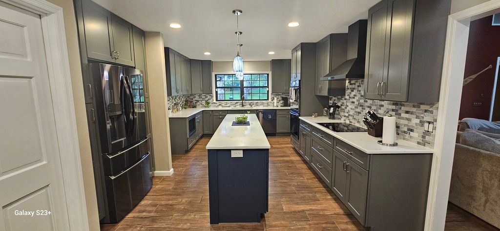 Kitchen remodel after photo: the remodeled kitchen finished and ready for use, view 1 of 2