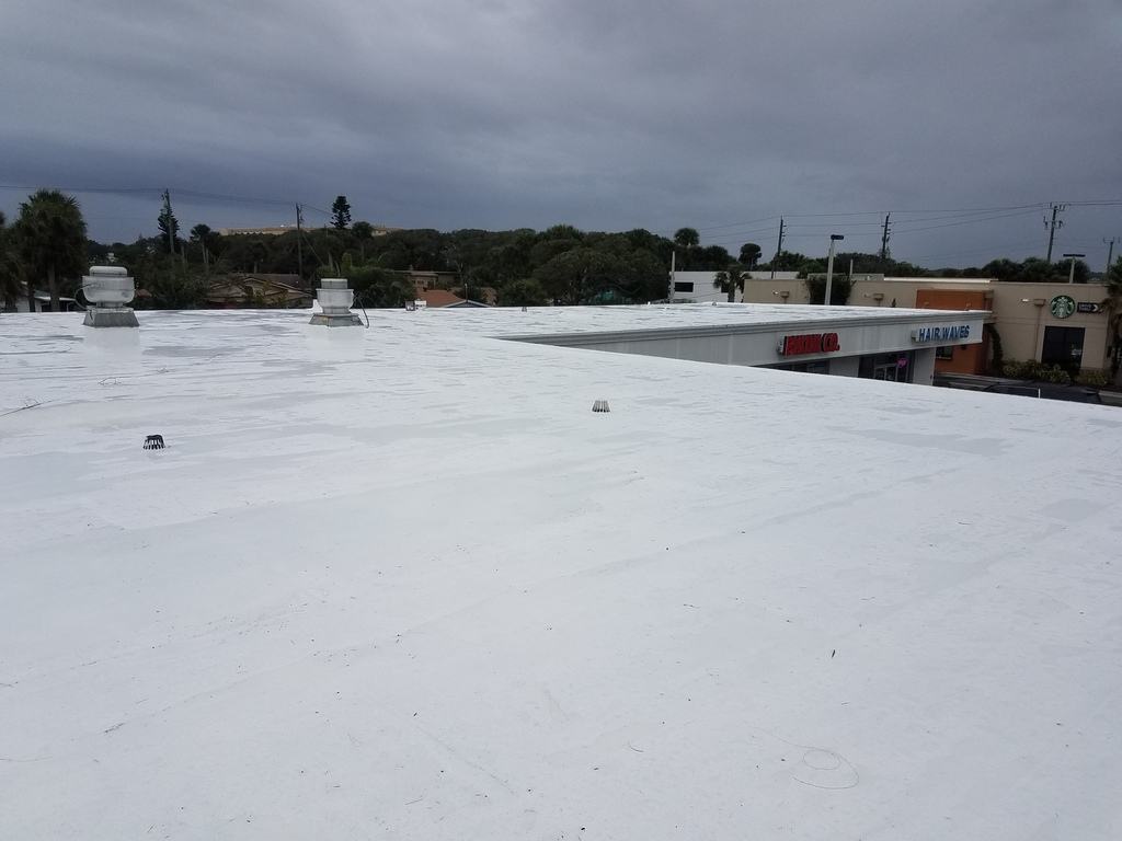 Silicone recovery system roof after photo: the flat roof finished with the new silicone coating, view 2 of 2