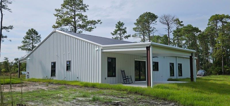 Barndominium new build exterior photo: the finished exterior of the completed barndominium, view 1 of 2