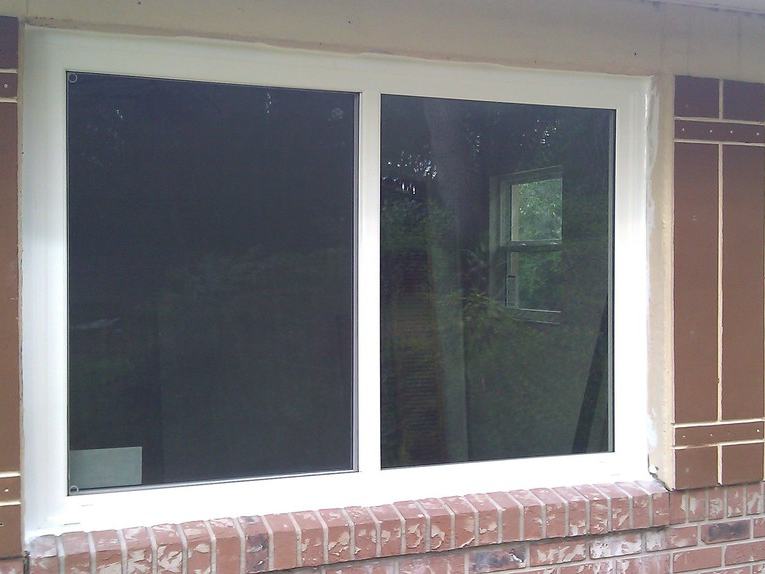 Window replacement after photo: the new replacement windows installed and finished, view 1 of 2