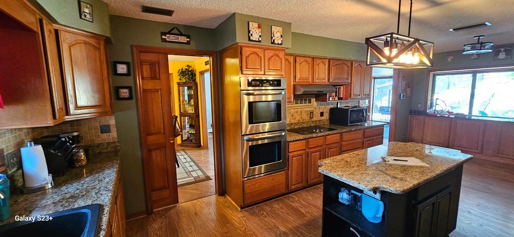 Kitchen remodel before photo: the original kitchen as it appeared before the remodel began, view 2 of 2