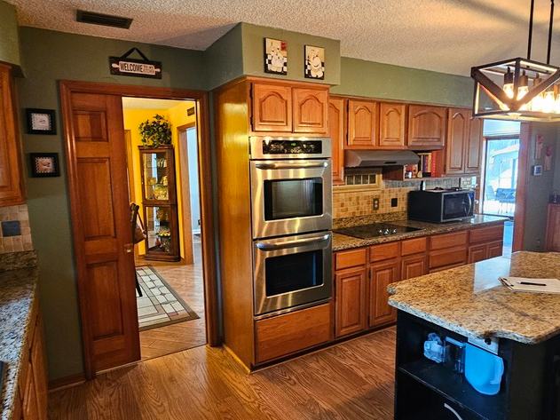 Kitchen remodel before photo: the original kitchen as it appeared before the remodel began, view 2 of 2