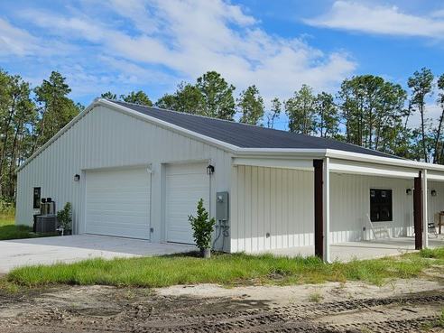 Barndominium new build exterior photo: the finished exterior of the completed barndominium, view 2 of 2