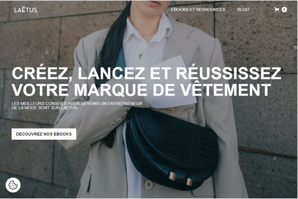 Website — Laetus Store homepage with fashion hero, ebooks CTA, and cart