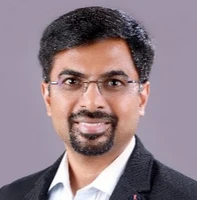 Headshot of Bhooshan Thakar, VP & GM of Data Resilience at Arctera