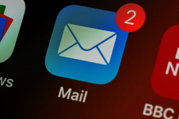 Mail app icon with unread message badge on a phone screen, illustrating a company mailbox running on its own domain