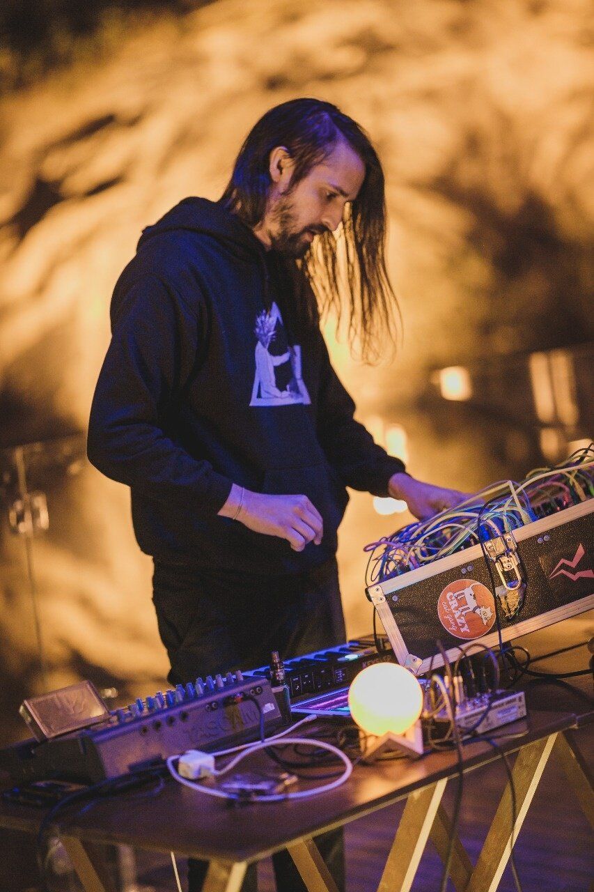 Profile shot of Felipe performing with his modular setup