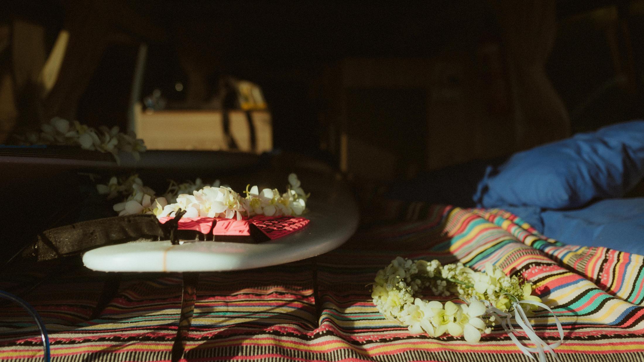 White flowers and fabric arranged inside the open van