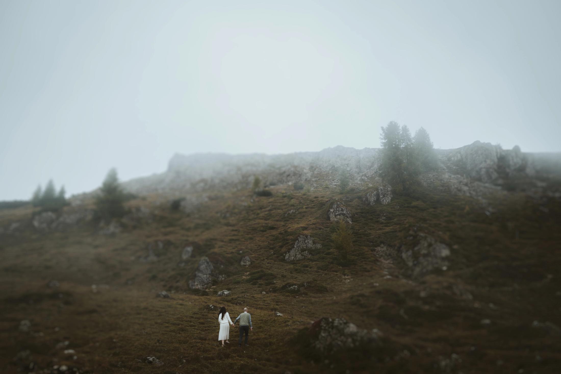 Jana and Steffen appearing small within a broad rocky landscape.
