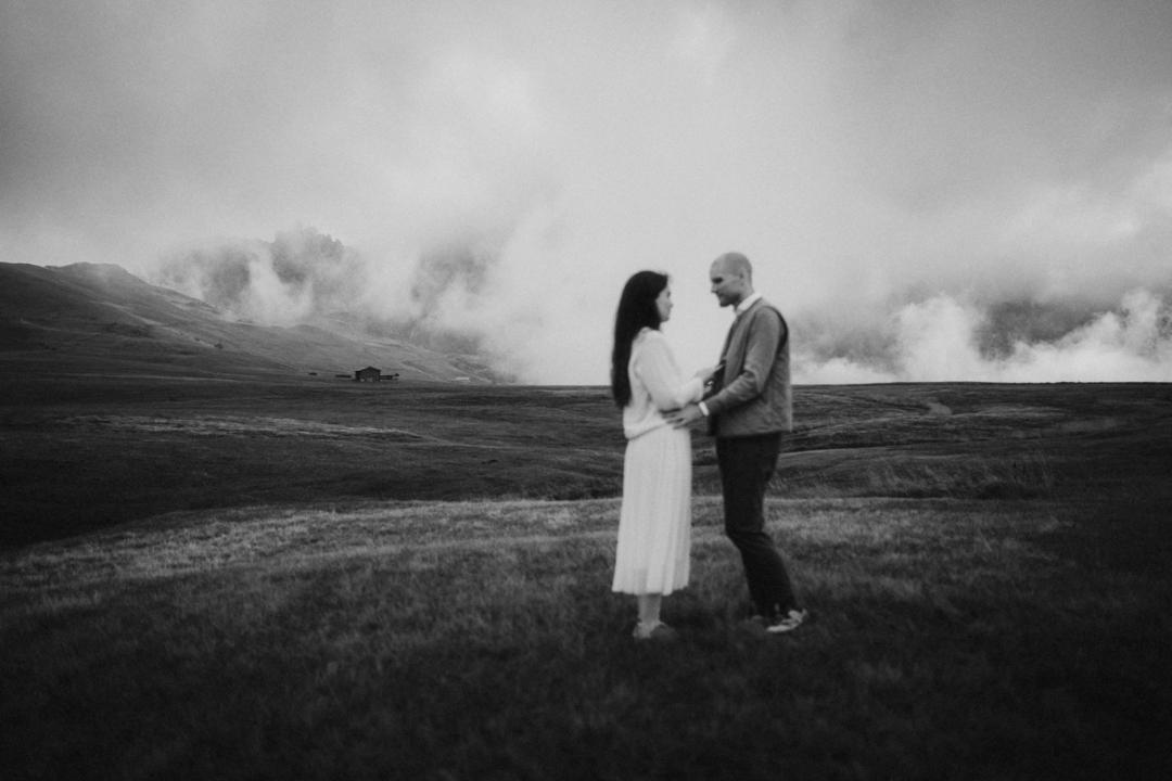 Jana and Steffen sharing private vows as the Dolomites emerge from the clouds