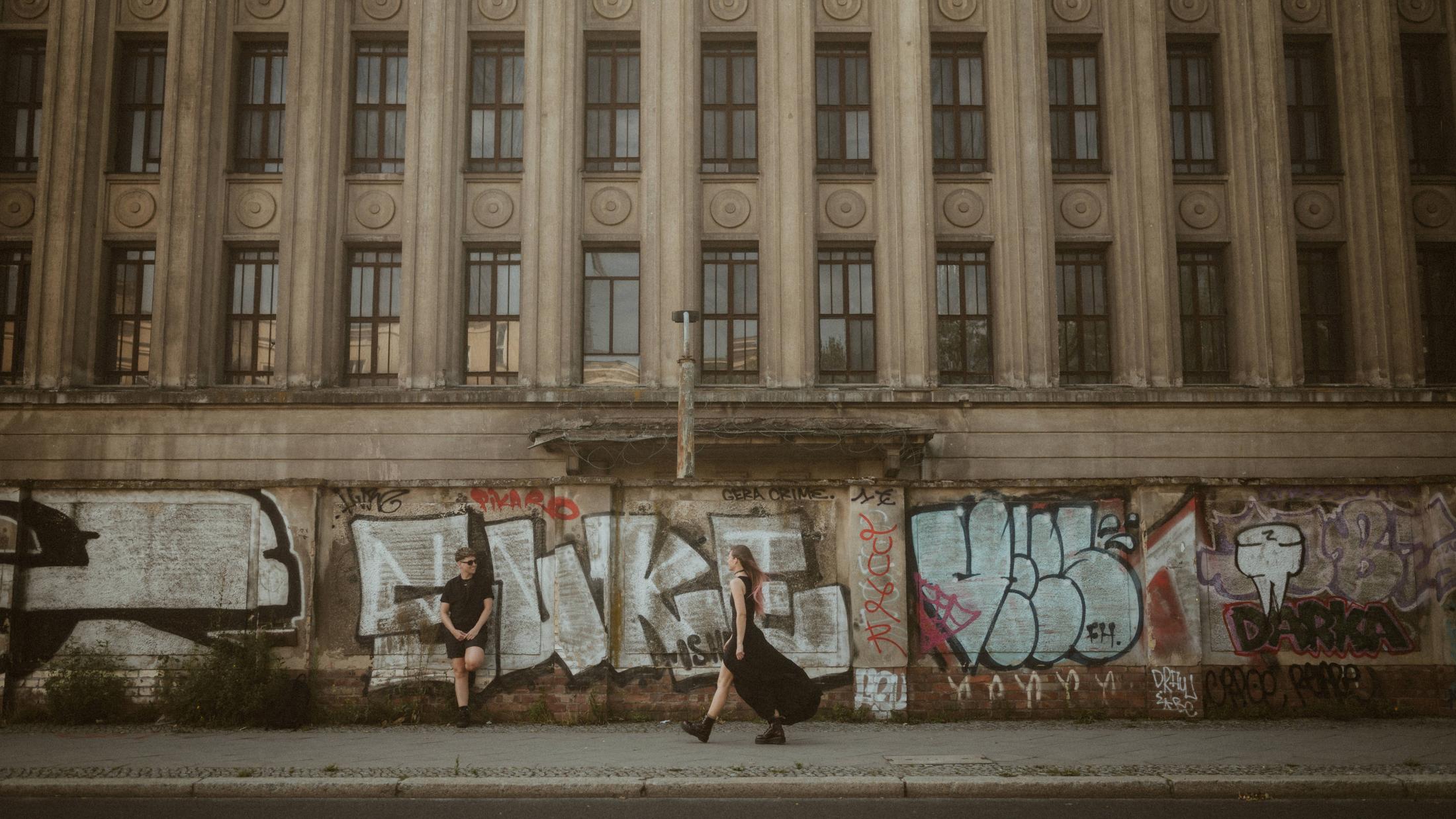 The large PAIN graffiti stretching across a Berlin building facade.