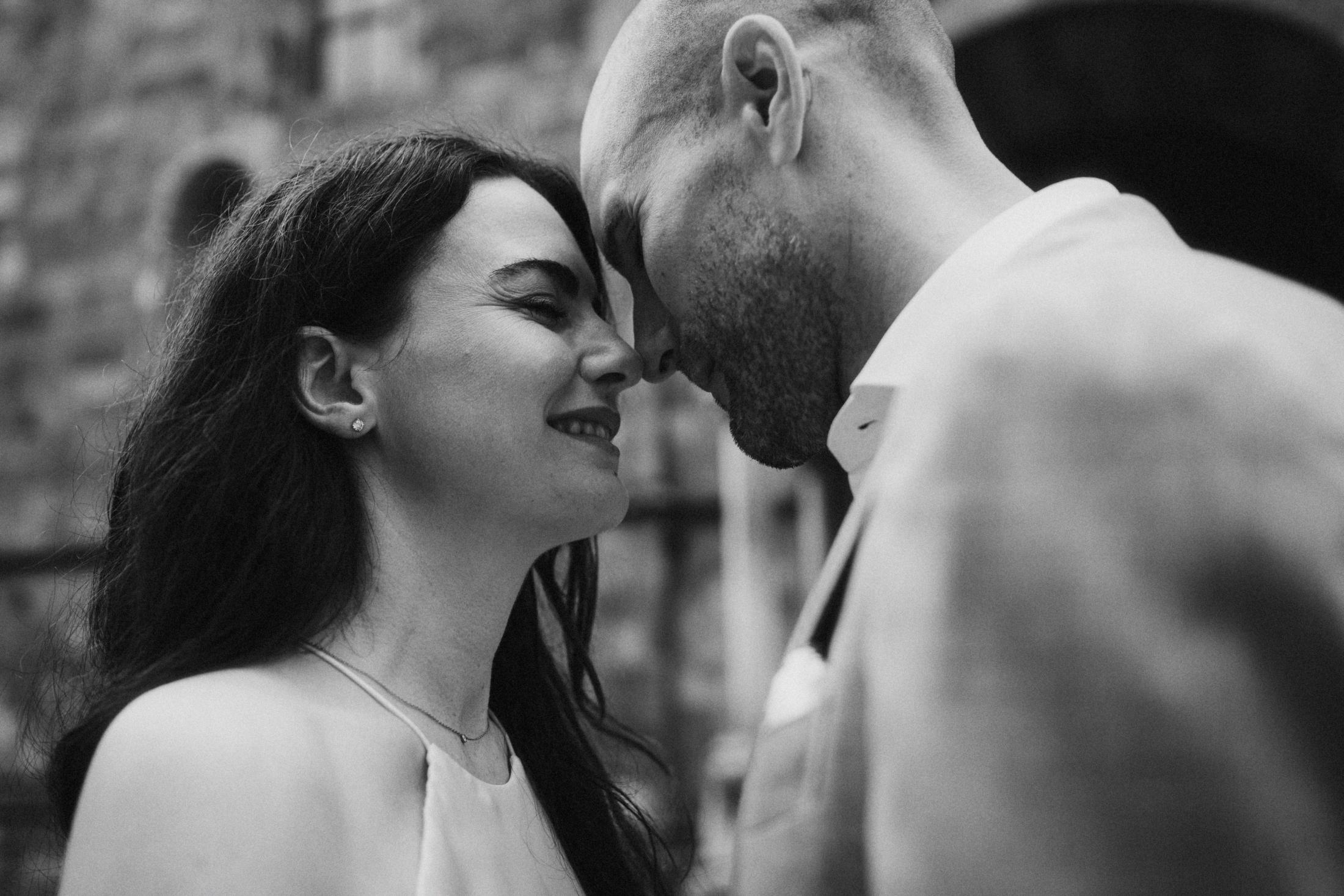 Close black-and-white portrait of Jana and Steffen with their faces touching.