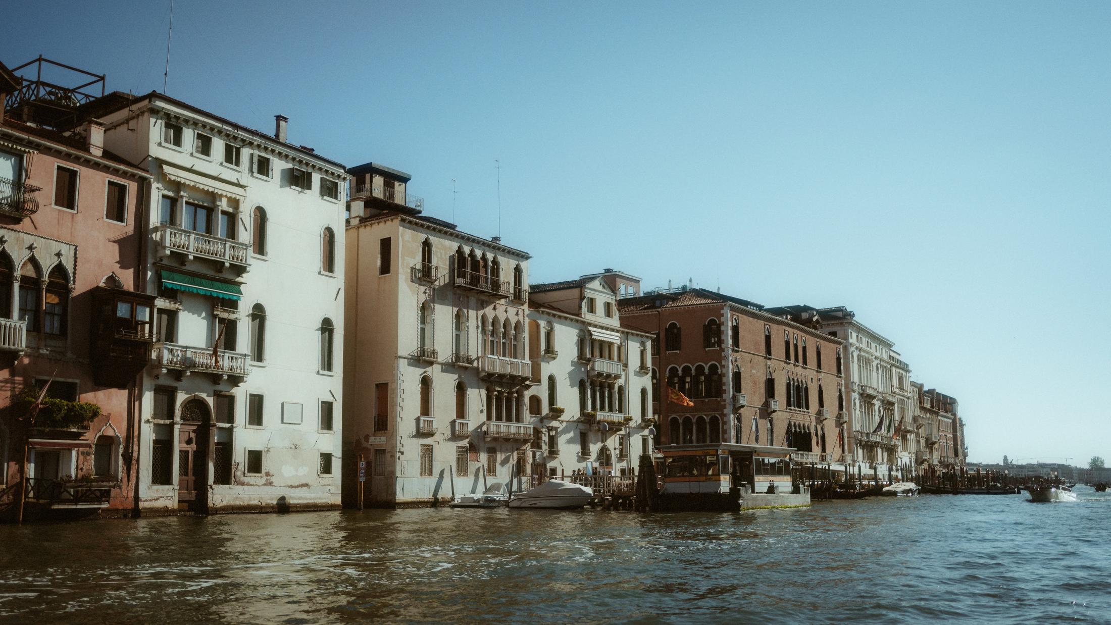 Venetian palaces line the water as the boat leaves the city behind.