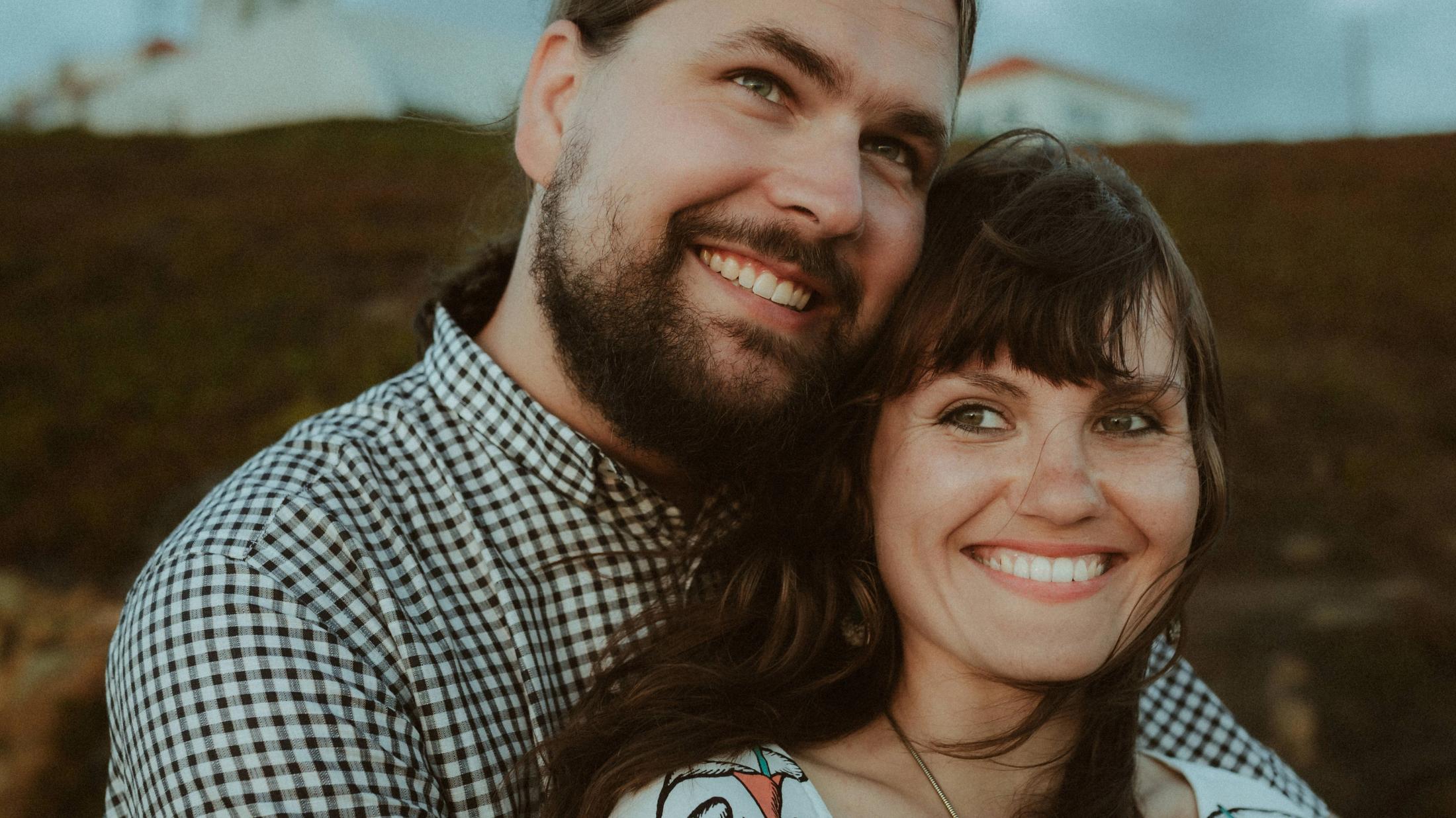 Coastal laughter during Ana and Till's Lovers Session in Portugal.