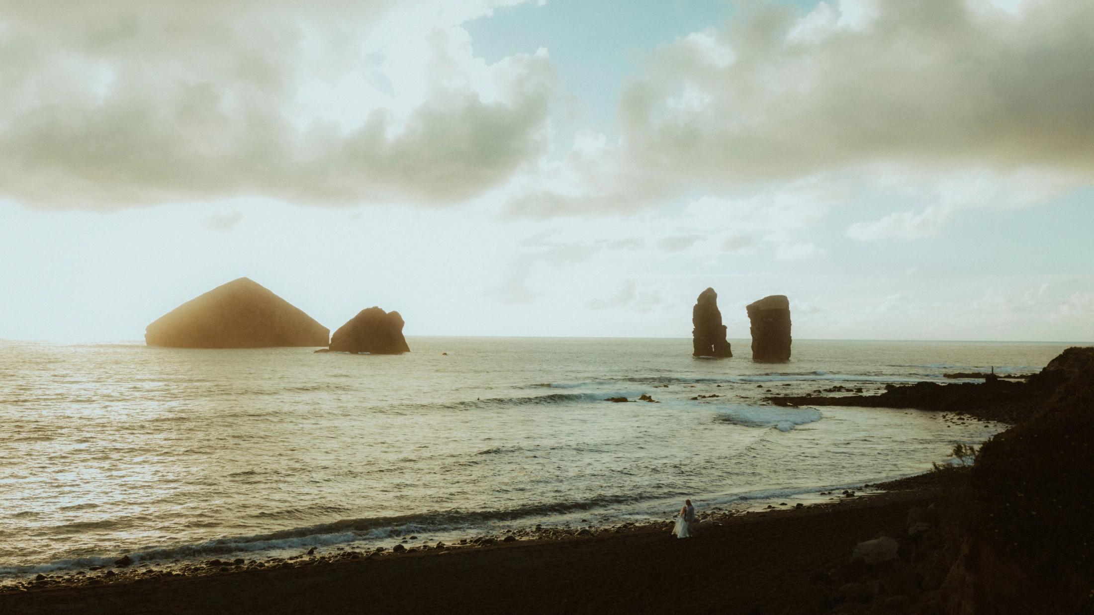 Atlantic sea stacks and dark volcanic coast close the story at dusk.