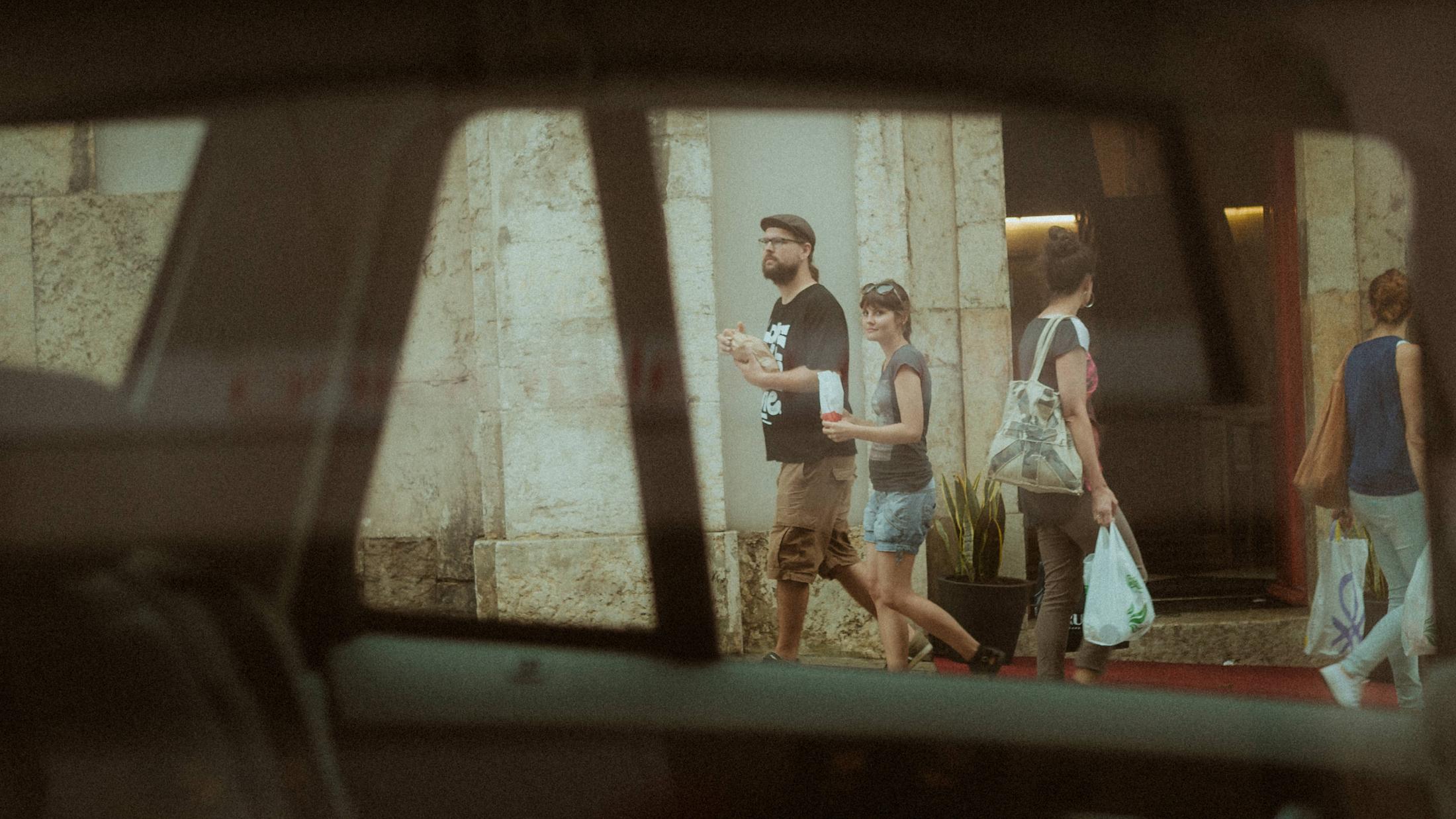 Shopfront reflection during Ana and Till's Lovers Session in Portugal.