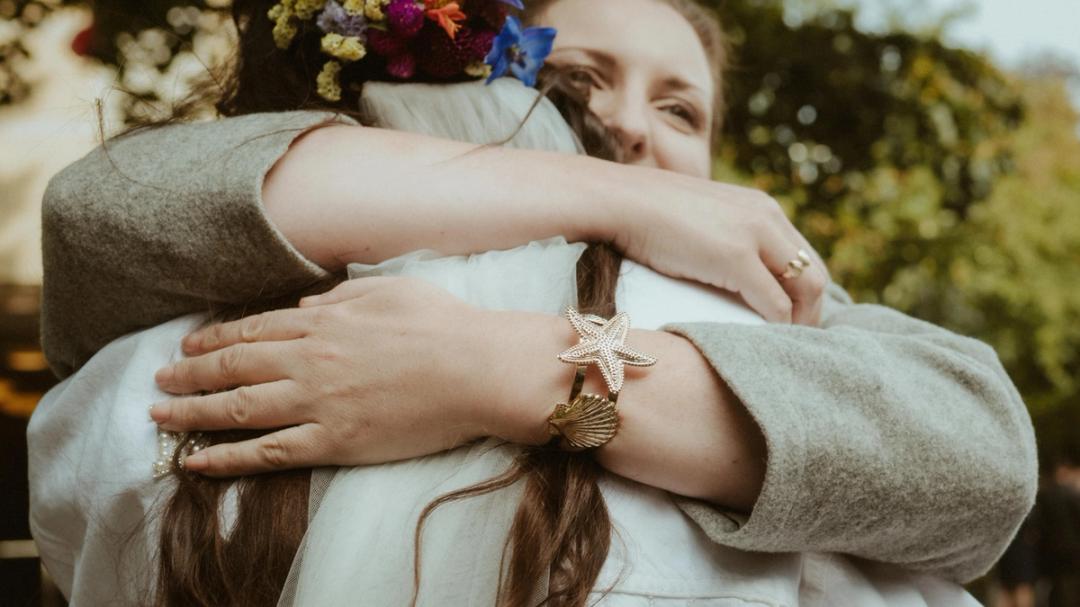 Laura embracing someone she loves during the wedding