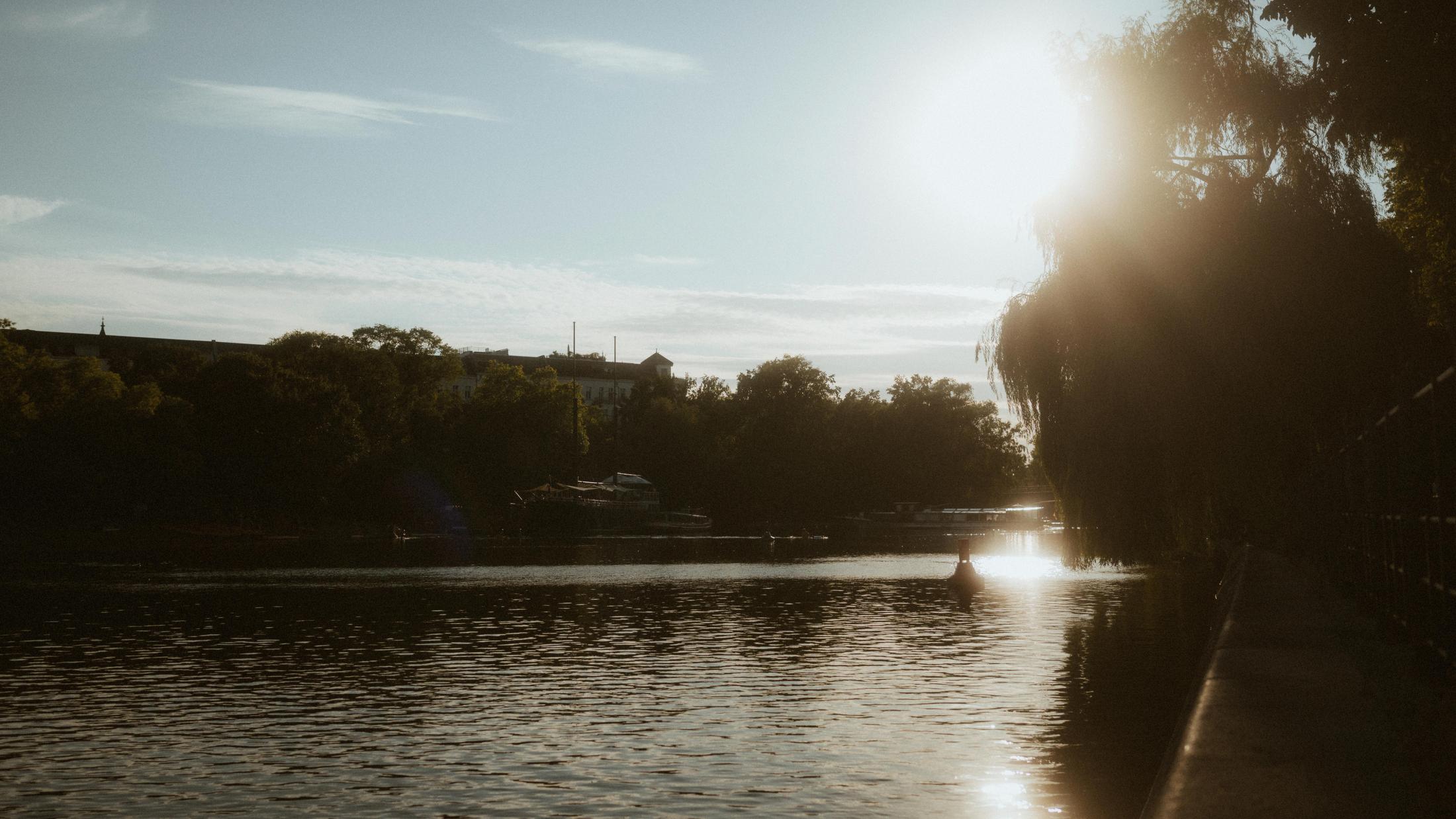 The low sun reflecting across the Landwehrkanal at the end of the day.