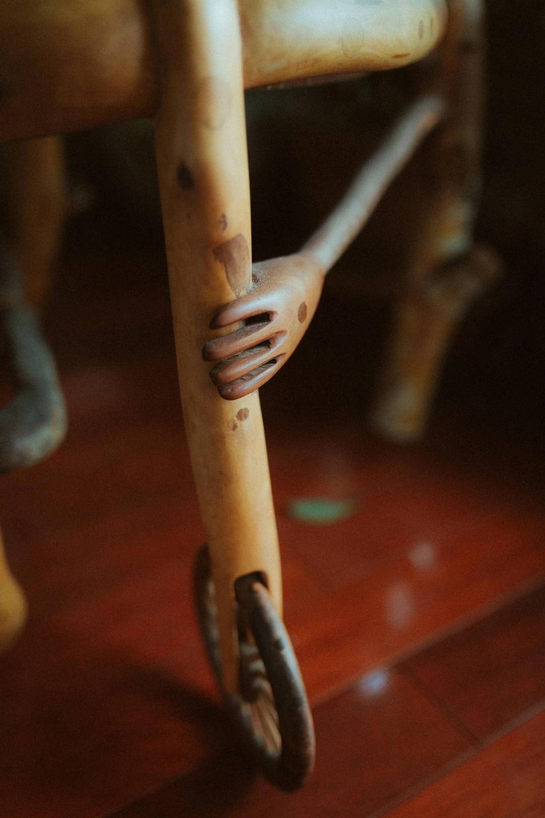 Close view of Maya’s arm and legs beside a chair.