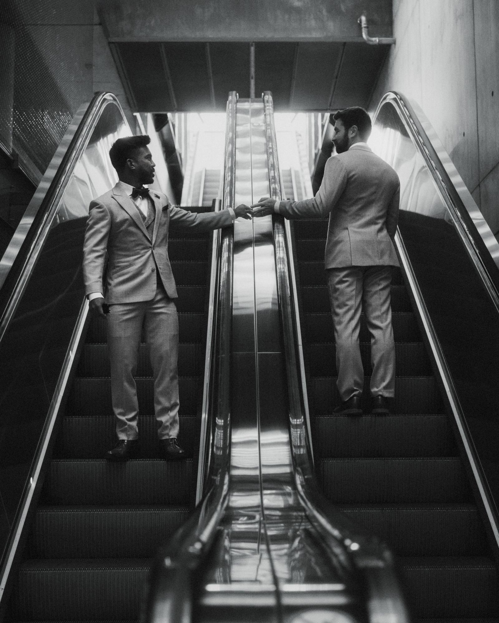 Couple photographed on an escalator, a deliberately built portrait composition in Copenhagen