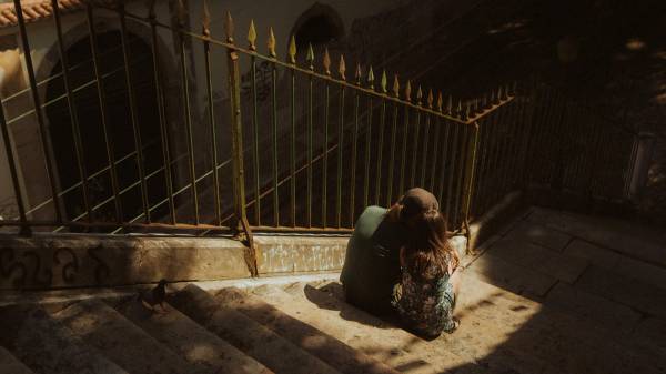 Ana and Till together in hard sunlight above Lisbon.