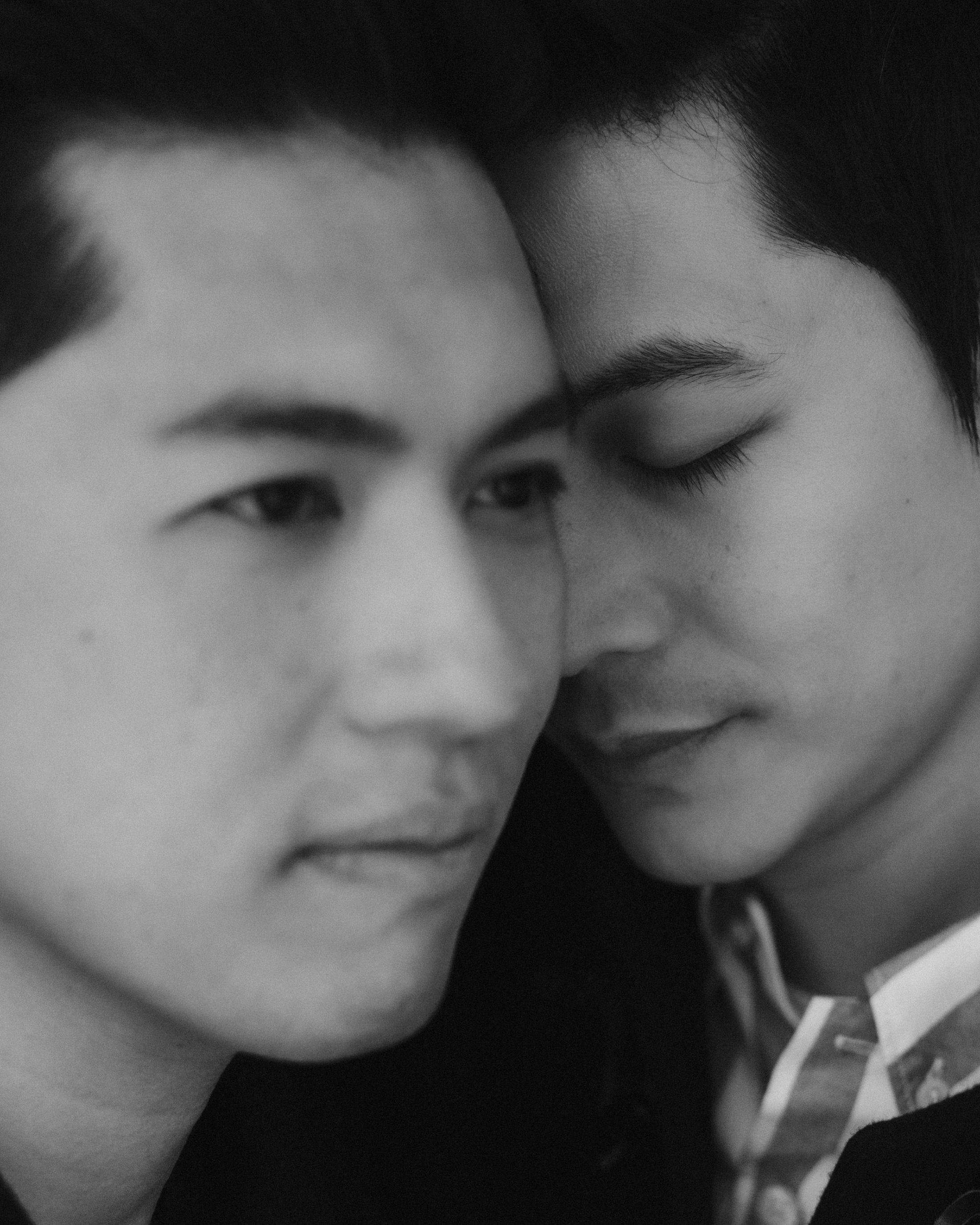 A blurred black-and-white double portrait of Kevin and Terence.