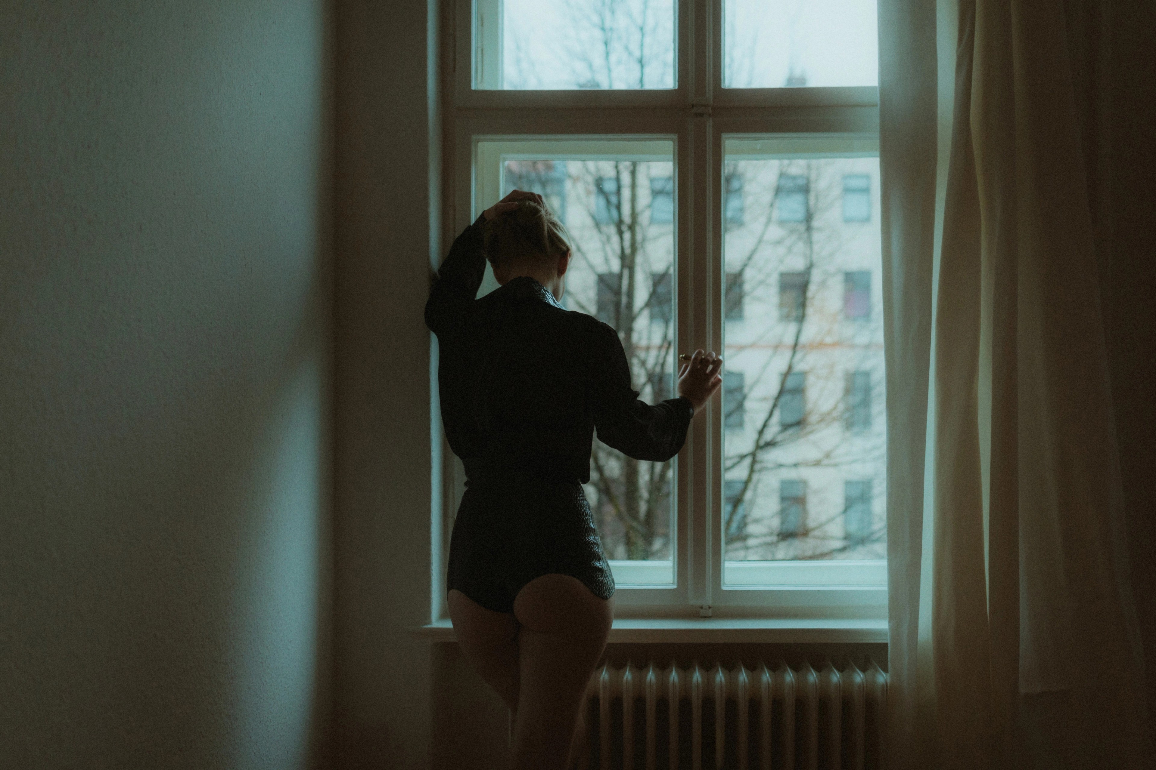 A direct intimate portrait in warm interior light