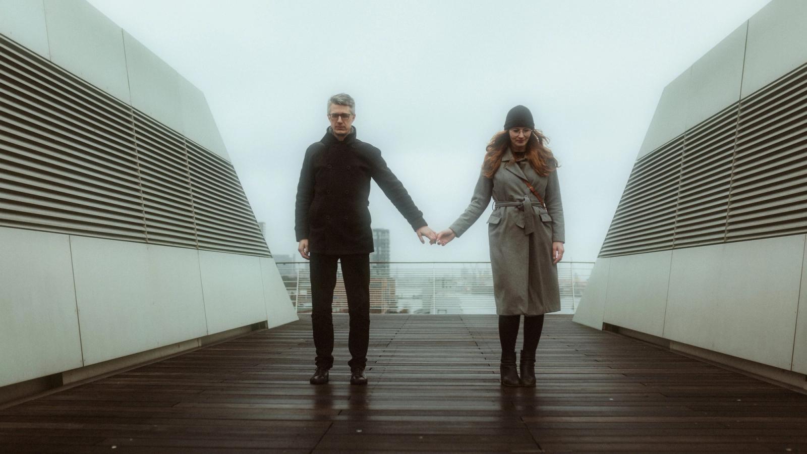 Nicole and Fritjof holding hands with space between them
