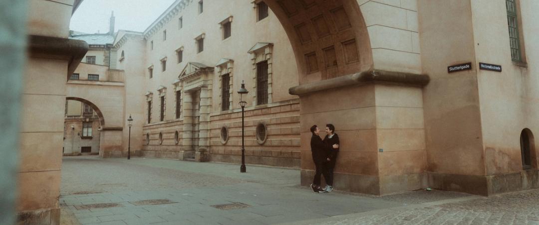 Kevin and Terence walking through a quiet Copenhagen street early in the morning