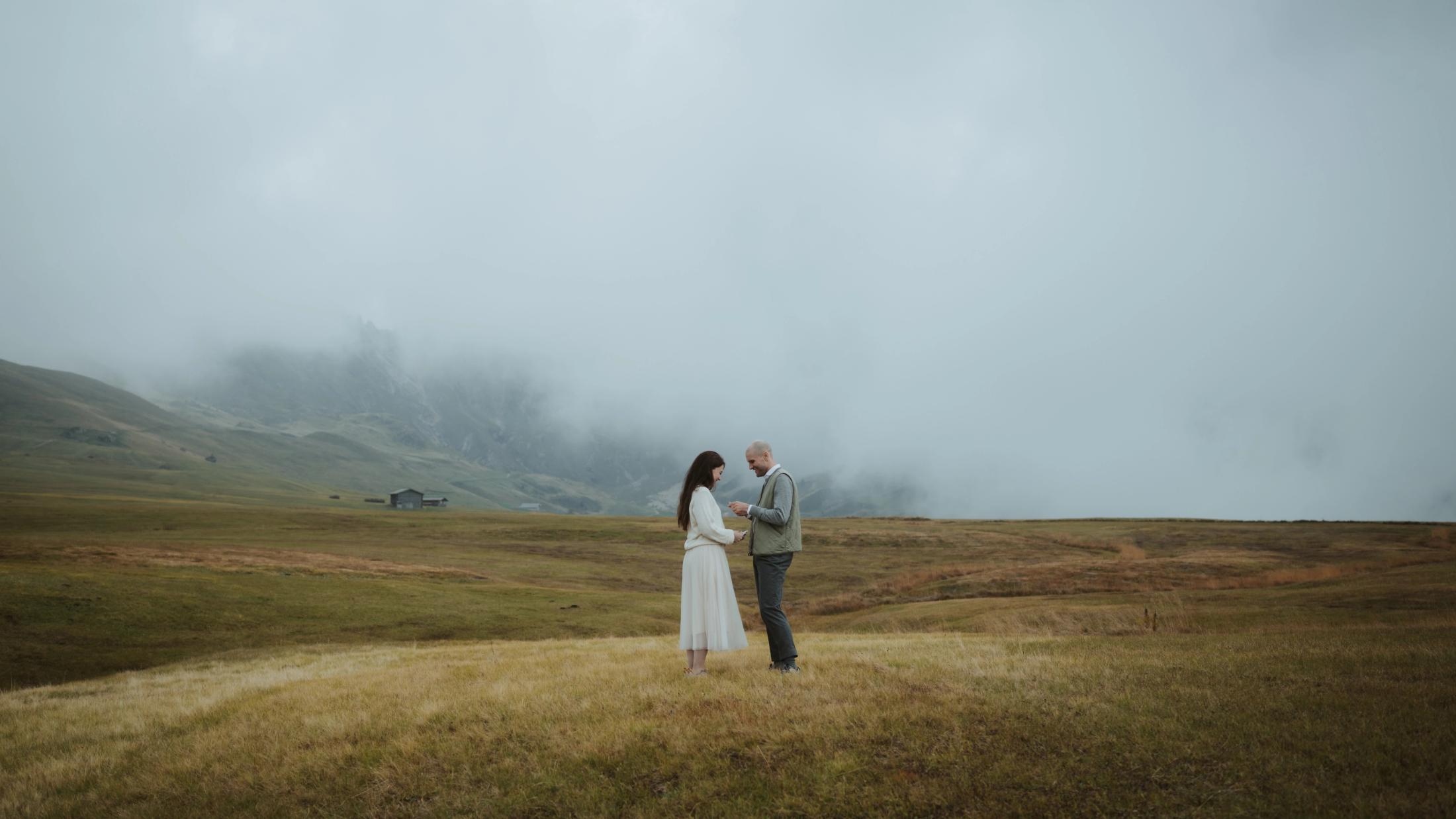 Wide view of Jana and Steffen beginning their private vows on a rocky rise.