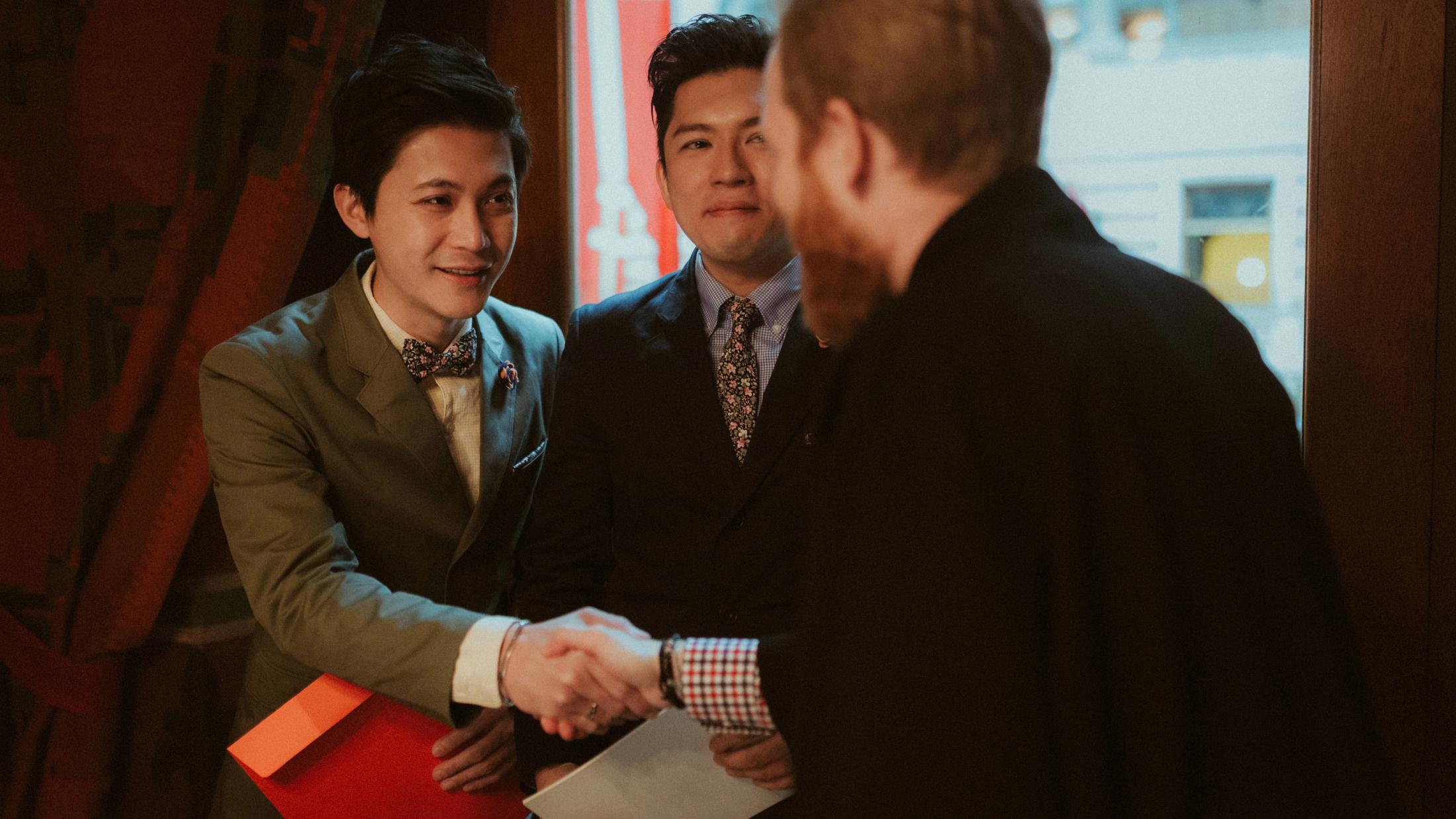 Kevin and Terence shake hands with the registrar after their ceremony.