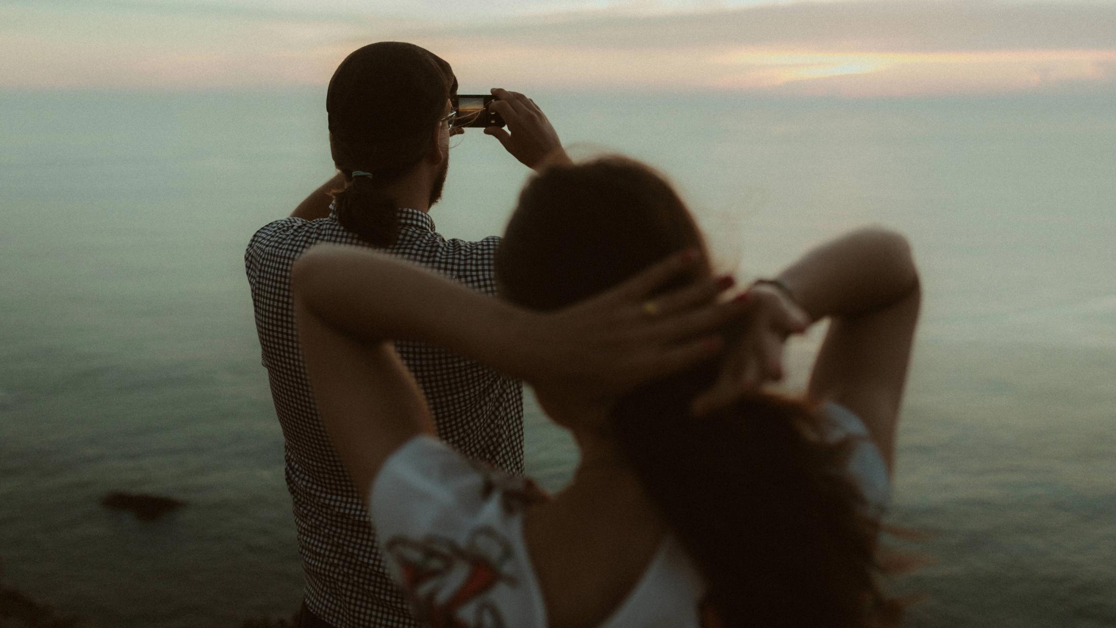 Ocean embrace during Ana and Till's Lovers Session in Portugal.