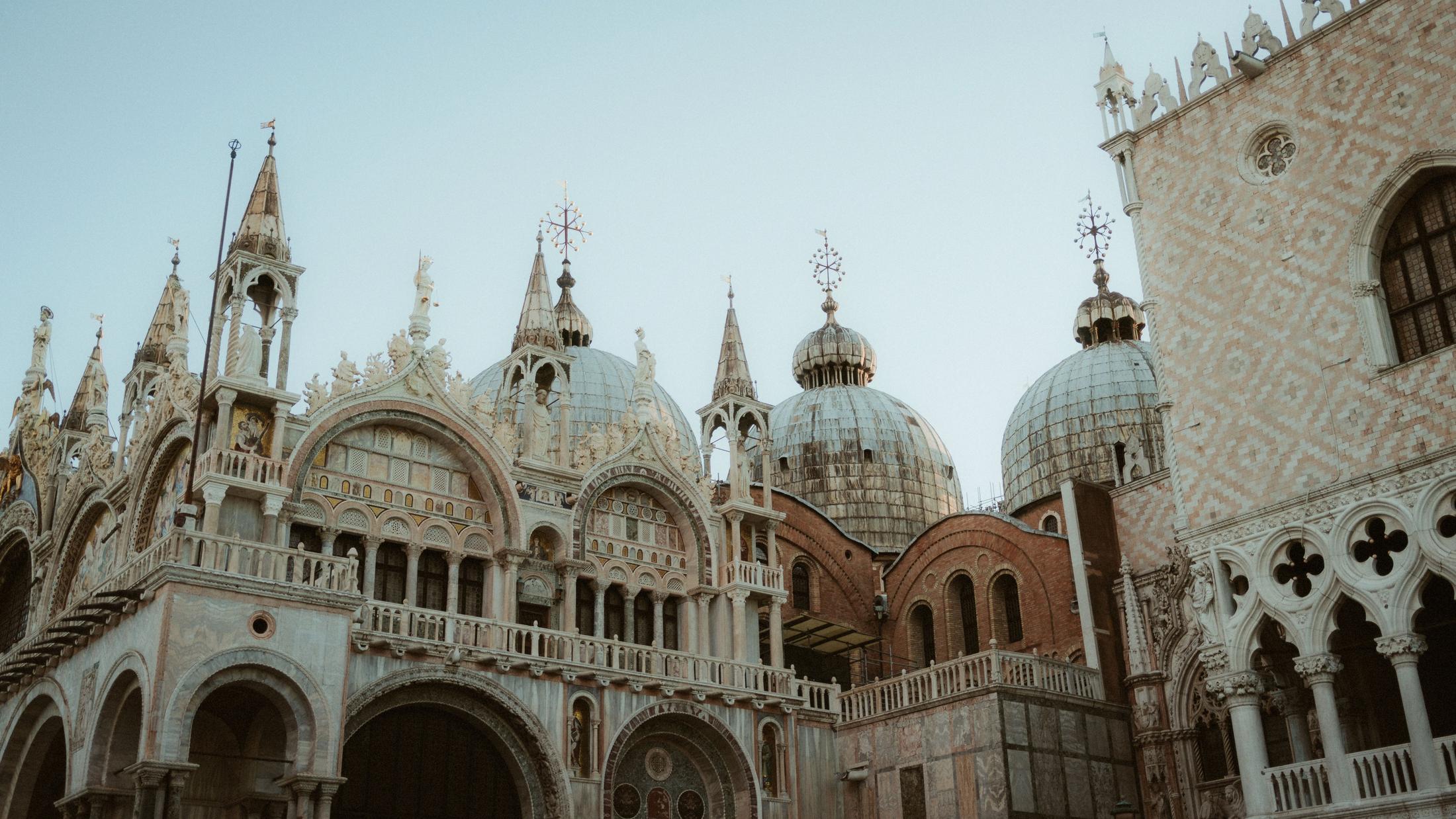 St Mark's Basilica and the Doge's Palace in the pale light before sunrise.