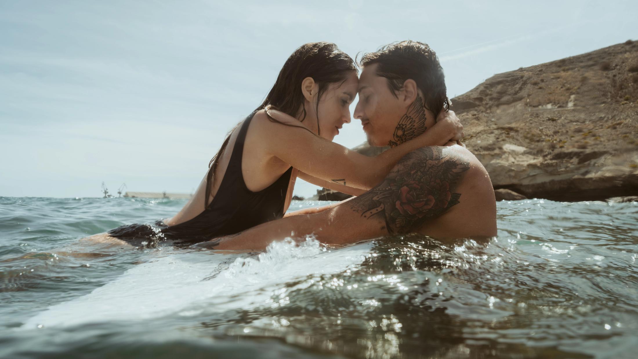 Angela and Ivan embracing in the Atlantic water