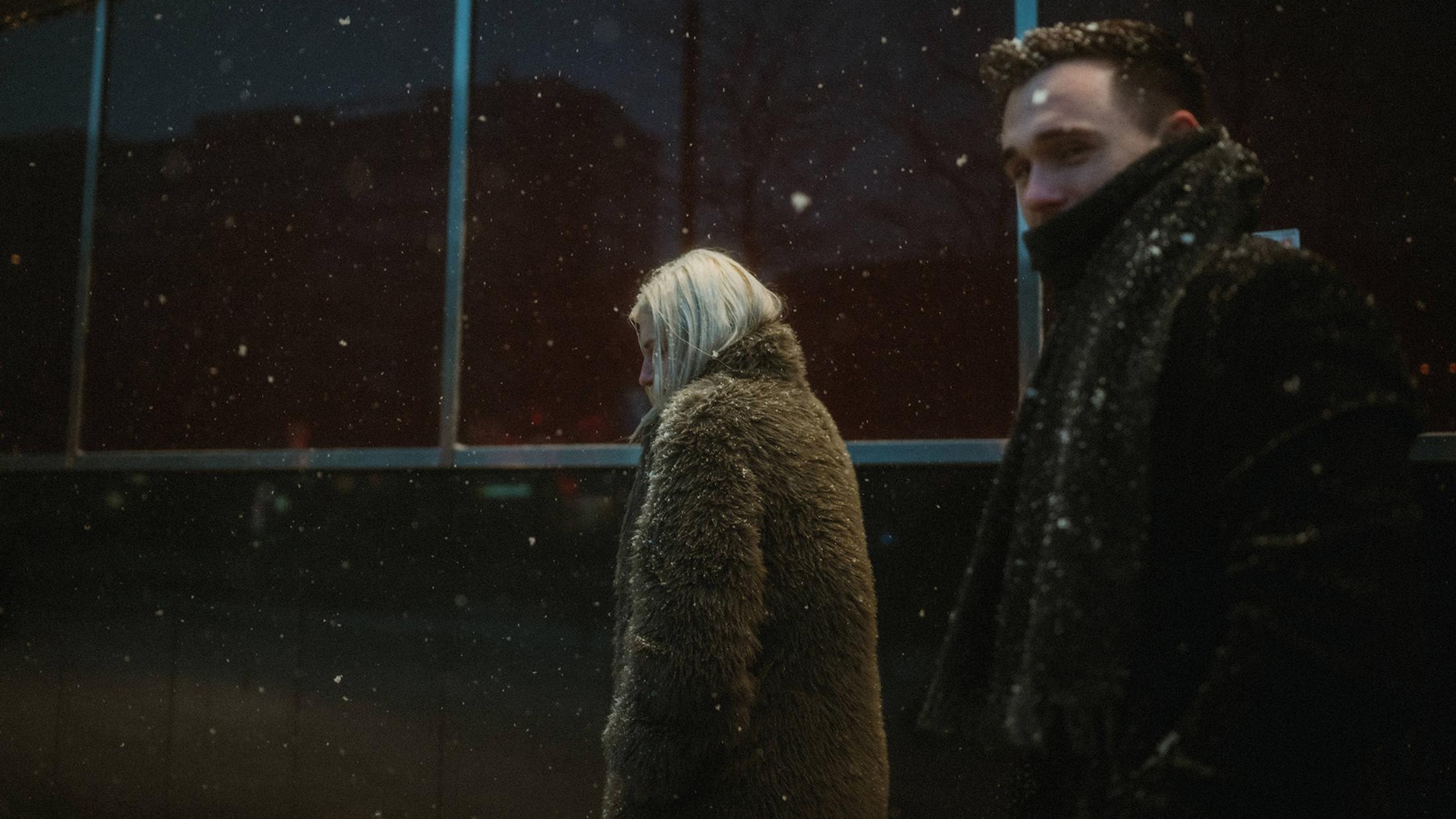 Lorelai and Steffen emerge into heavy snow outside St. Pauli station.