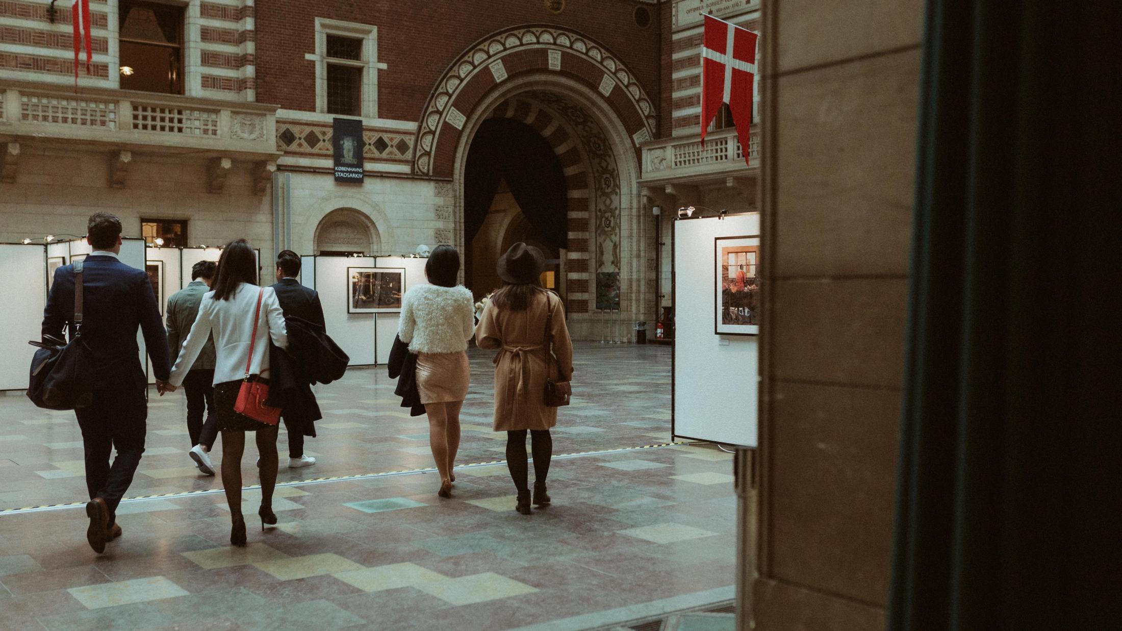 Kevin, Terence and their friends enter the courtyard of Copenhagen City Hall.