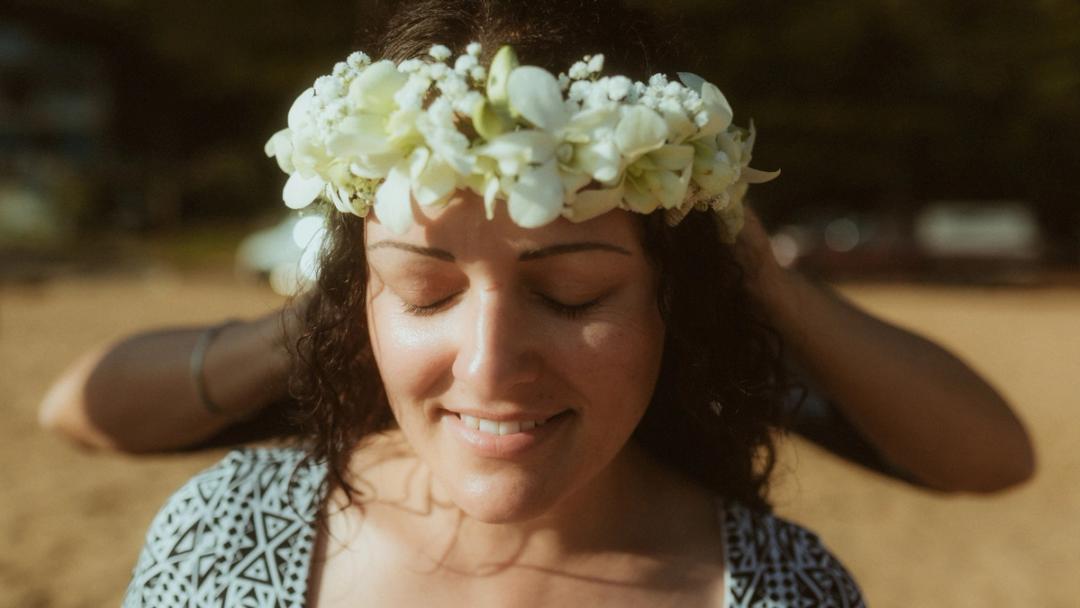 Roman adjusting Petra's white flower crown