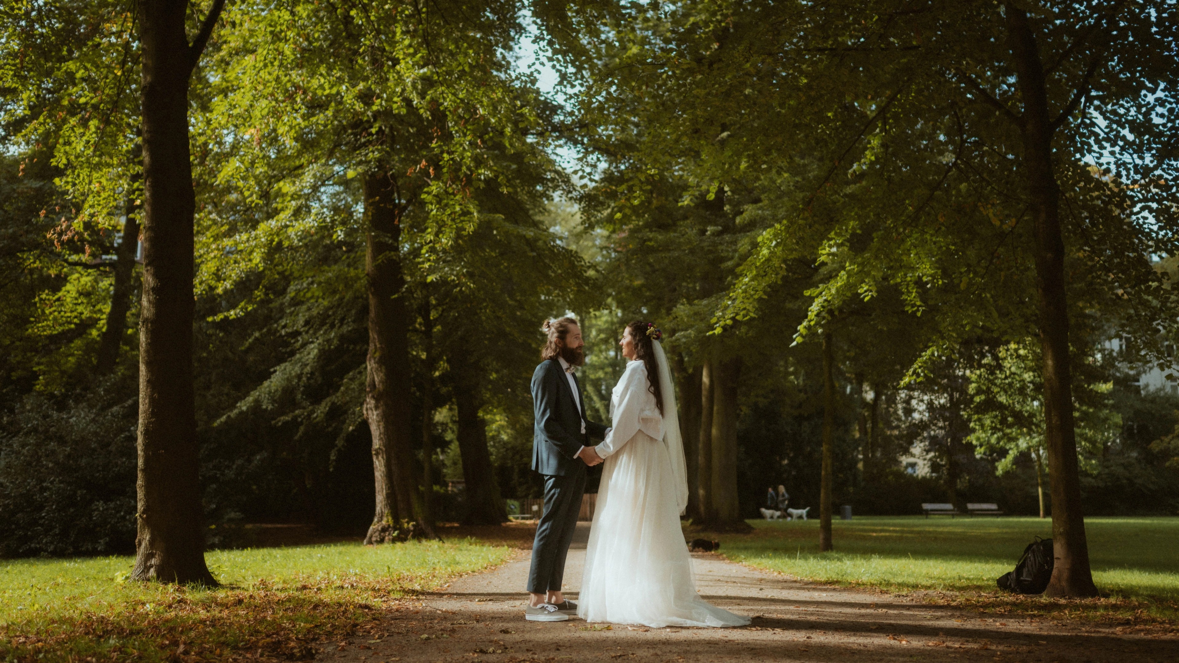 Laura and Olaf walking together through green surroundings