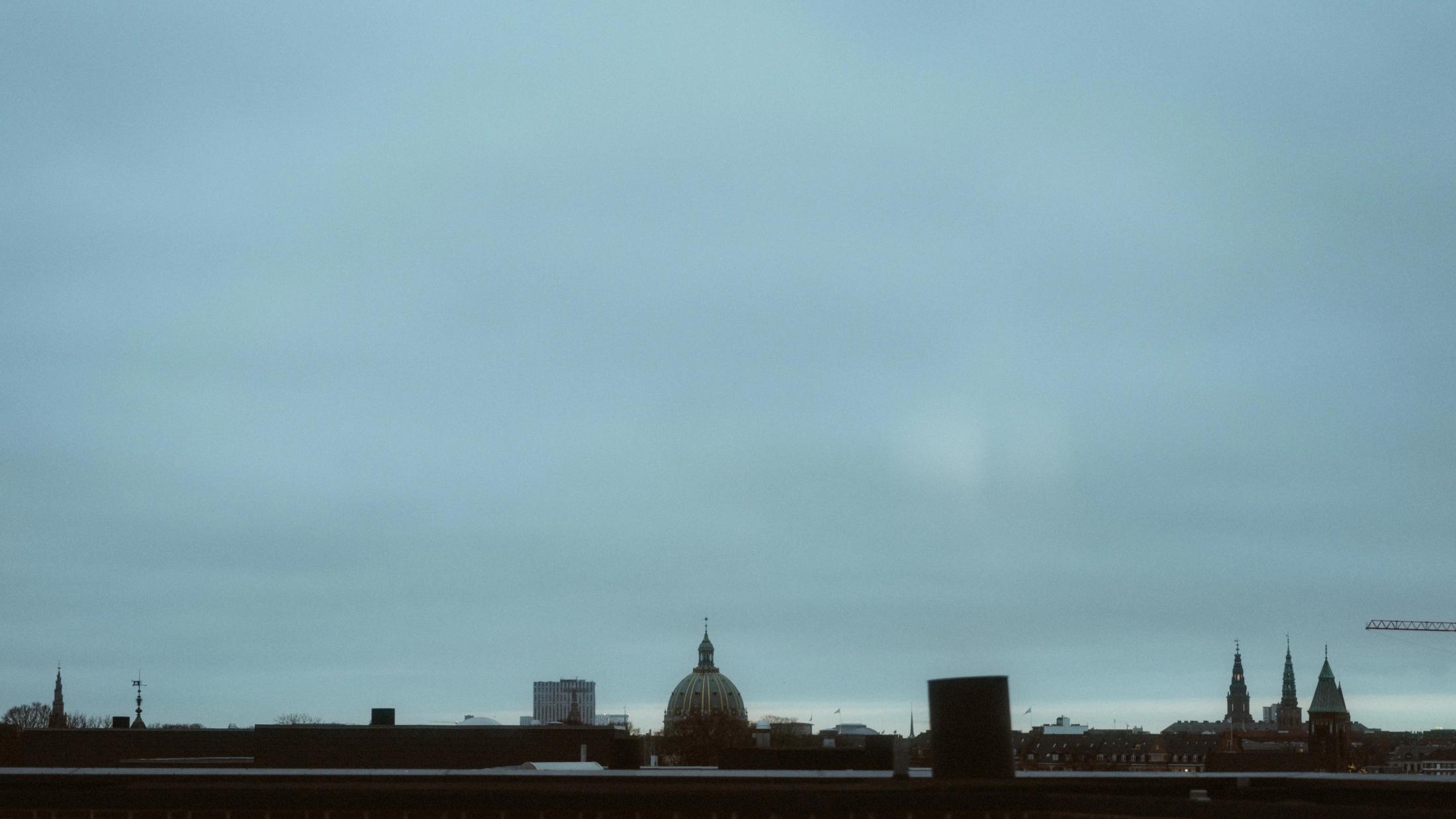 Copenhagen skyline beneath a grey winter sky