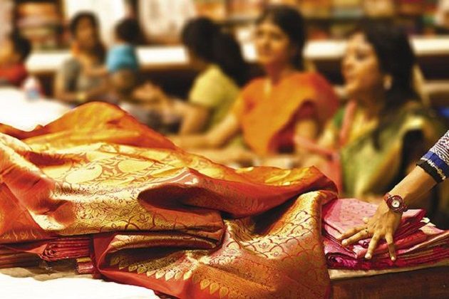 A display of vibrant Mangalagiri cotton sarees with the signature zari border