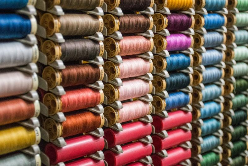 Assorted colourful silk threads on spools