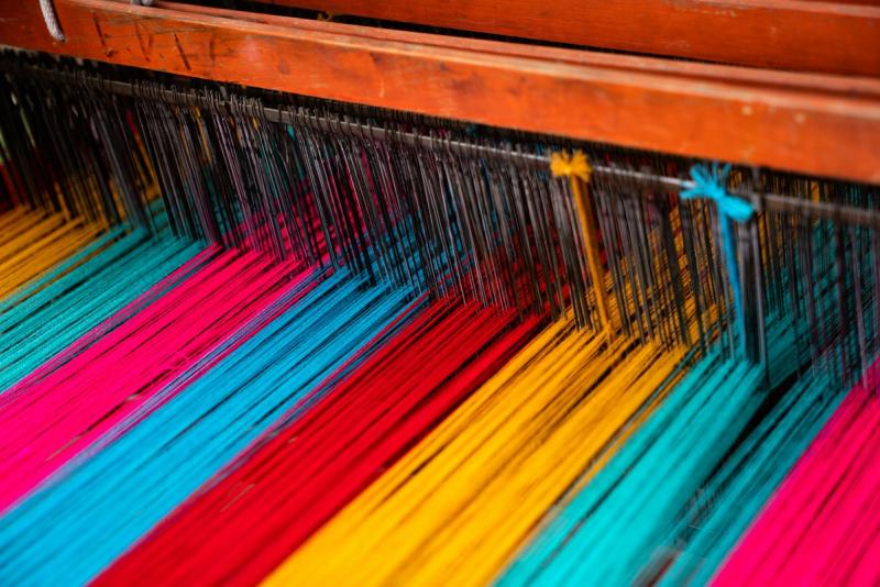 Assorted colourful textile samples showing weaving patterns