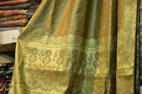 A gold-brocade Banarasi silk saree on display at Dilli Haat
