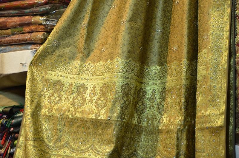 A gold-brocade Banarasi silk saree on display at Dilli Haat