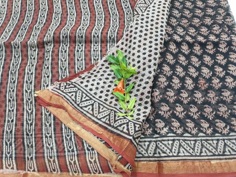 Block-printed Kota Doria sarees in earthy tones showing the signature khat-check weave