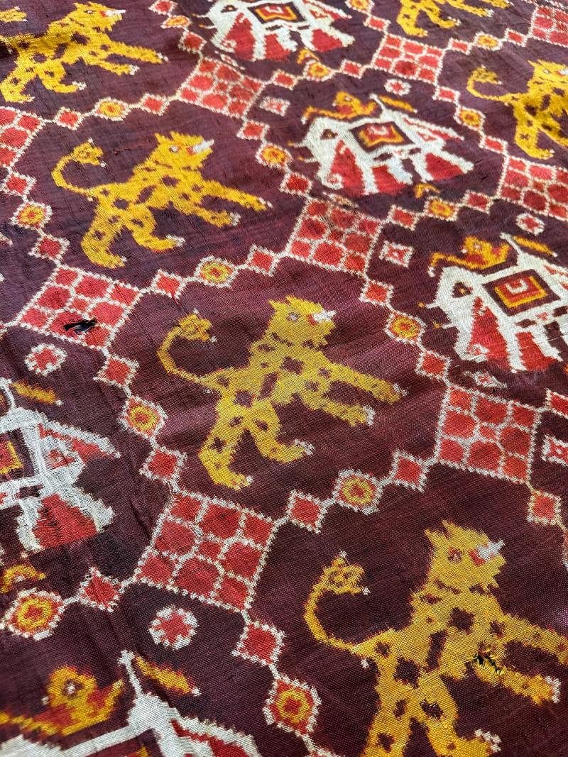 An antique Patan Patola double-ikat textile with elephant and tiger motifs